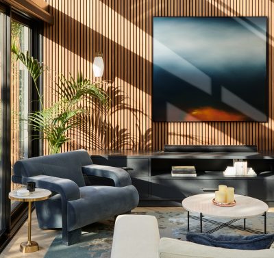 Sunlit London living room with timber wall panelling, contemporary furniture, and large windows designed by The Stylesmiths.