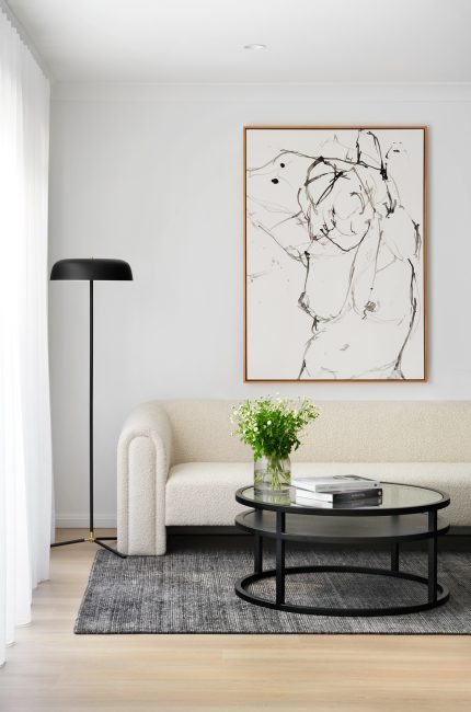 Contemporary Primrose Hill living room with boucle sofa, monochrome artwork, and minimalist styling.