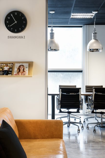 Modern Primrose Hill office interior with leather seating, black accents, and natural light designed by The Stylesmiths London.