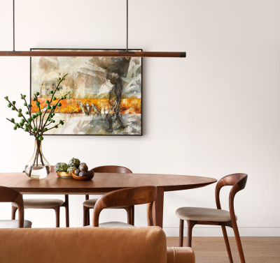 Scandinavian dining room with warm timber table, minimalist linear pendant light and soft neutral wall styling.